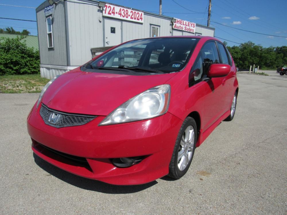 2010 Red /BLACK/GRAY Honda Fit Sport 5-Speed MT (JHMGE8G42AC) with an 1.5L L4 SOHC 16V engine, 5-Speed Manual transmission, located at 6 Oliver Rd., Uniontown, PA, 15401, (724) 438-2024, 0.000000, 0.000000 - Photo #0